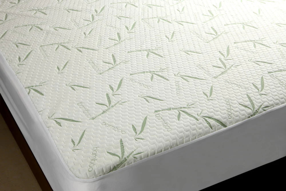 Bamboo mattress protector with green bamboo patterns, providing a soft and smooth sleeping surface.