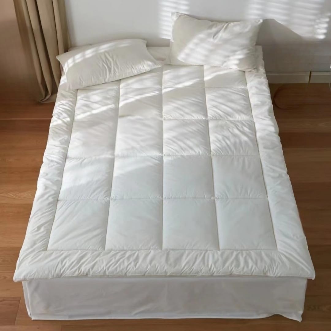 Continental Bedding down alternative comforter neatly styled on a bed with pillows in natural light, featuring box stitching, soft cotton shell, and all-season warmth.