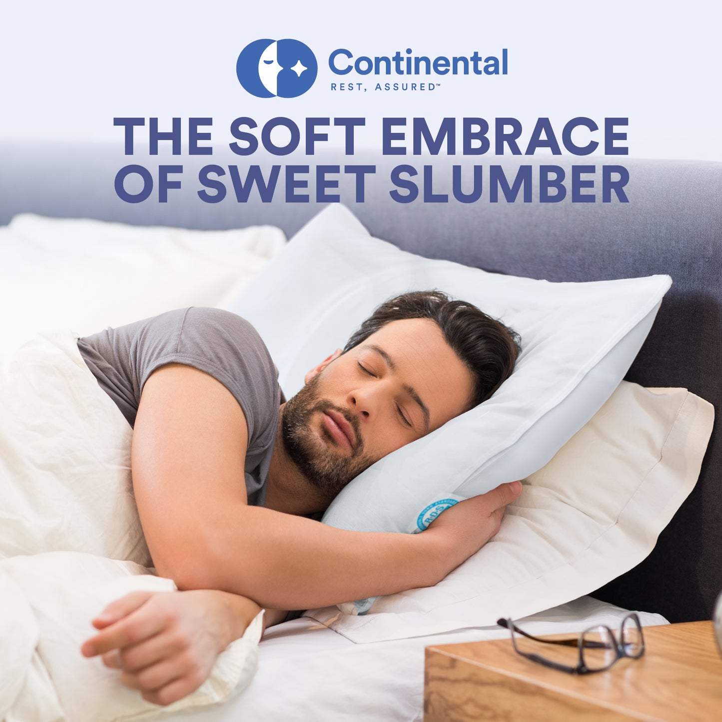 Man sleeping on his side, using Continental's pillow designed for side sleepers, providing optimal support and comfort.