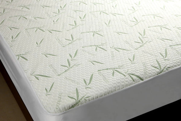 Bamboo mattress protector with green bamboo patterns, providing a soft and smooth sleeping surface.
