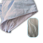 Light blue bamboo comforter shown with wave-style stitch detailing and soft, breathable fabric highlighted in a close-up inset.

