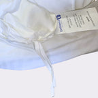 Inside view of toddler duvet protector showing corner tie and product tag from Continental Bedding
