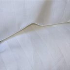 Detailed view of soft damask stripe fabric texture on duvet protector

