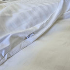 Zipper closure detail on toddler duvet protector lying flat on bed
