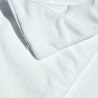 Close-up view of the zipper on the fleece pillow protector, highlighting the secure closure and fine stitching